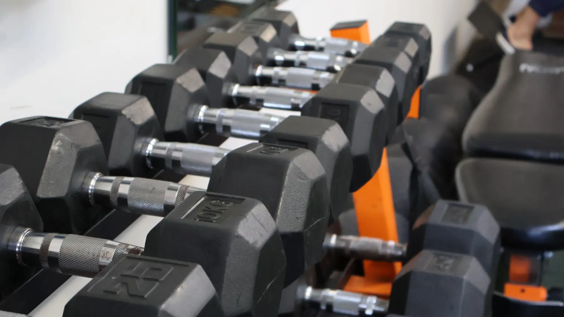 Sidhu Fitness dumbbell rack and resistance equipment in the private personal training gym