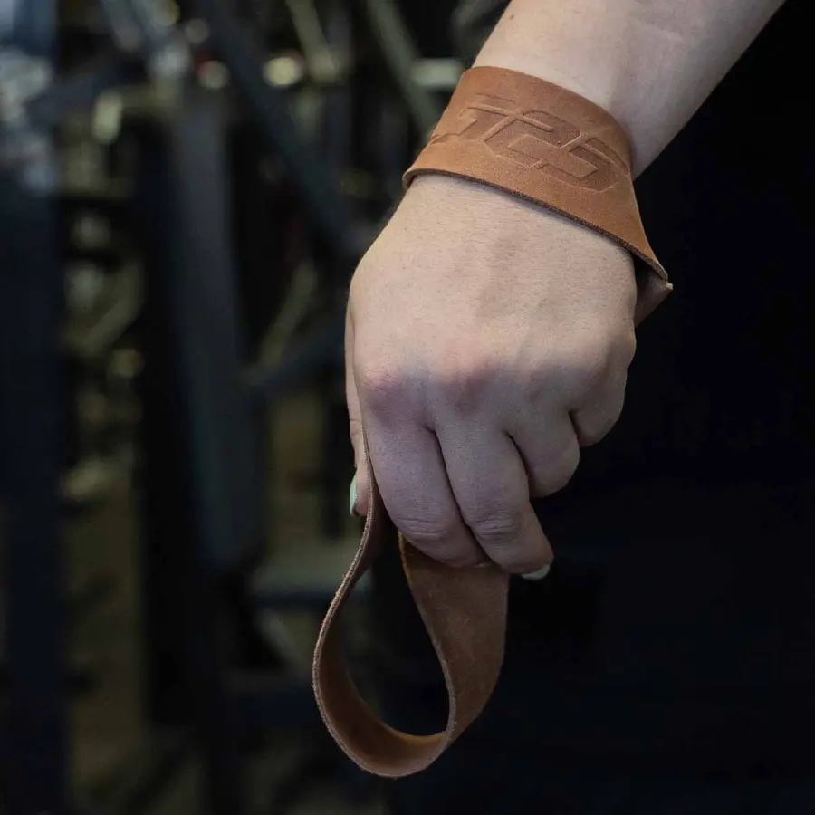 TeamIndustry lifting strap held in a gym