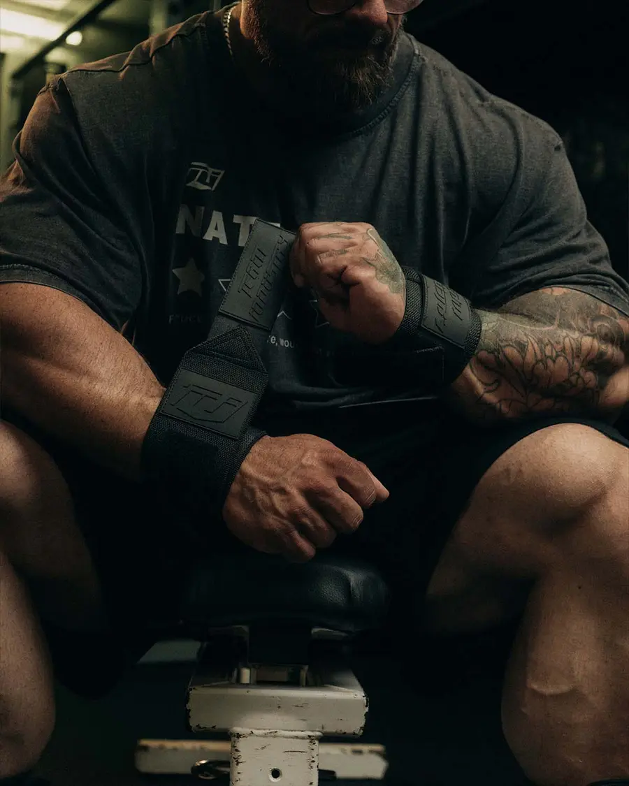 TeamIndustry black wrist wraps worn in a gym